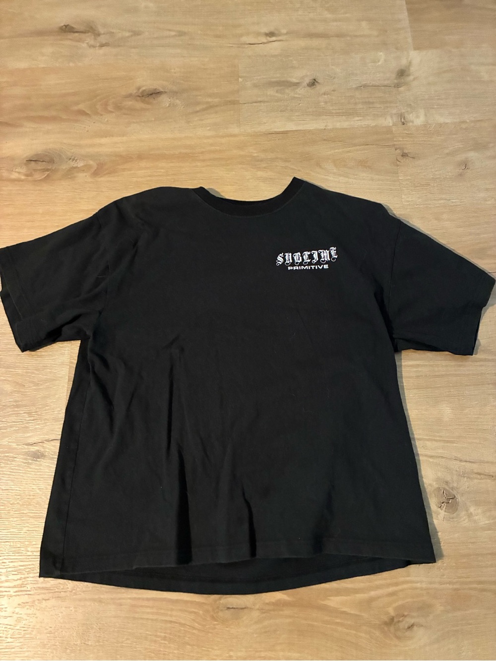 Primitive Black Tee with White Chest Logo